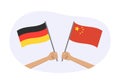 Germany and China flags. German and Chinese national symbols. Hand holding waving flag. Vector illustration Royalty Free Stock Photo